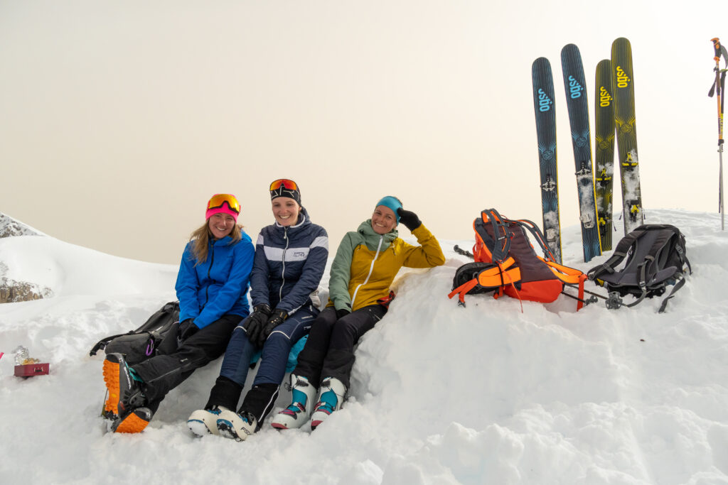 friends chilling at the summit after an ascent